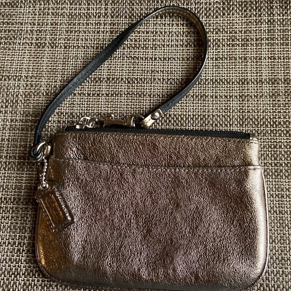 Small metallic bronze coach wristlet; no sign of real wear, clean, no tears.